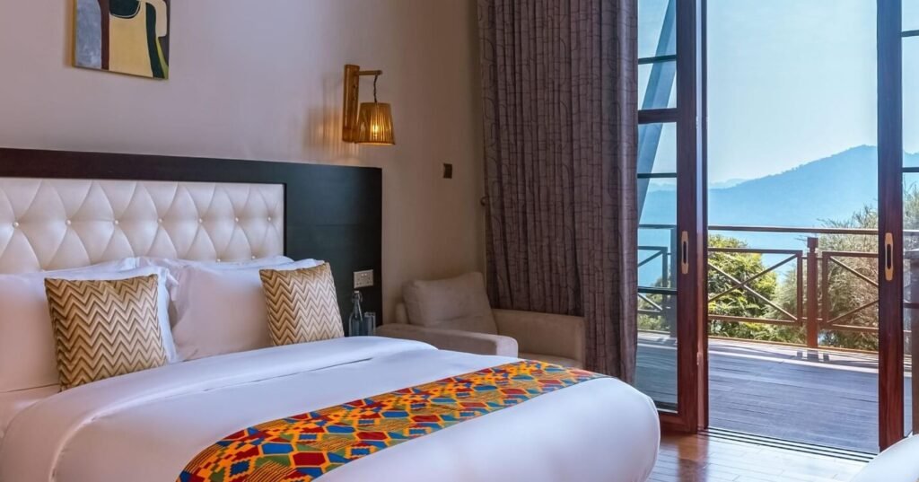High-end suite interior with a plush king-size bed and contemporary African-inspired design.