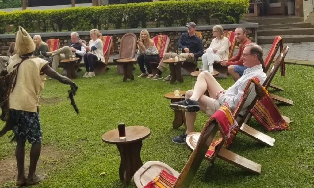 Travellers watching a traditional Ugandan cultural dance performance near Bwindi Forest