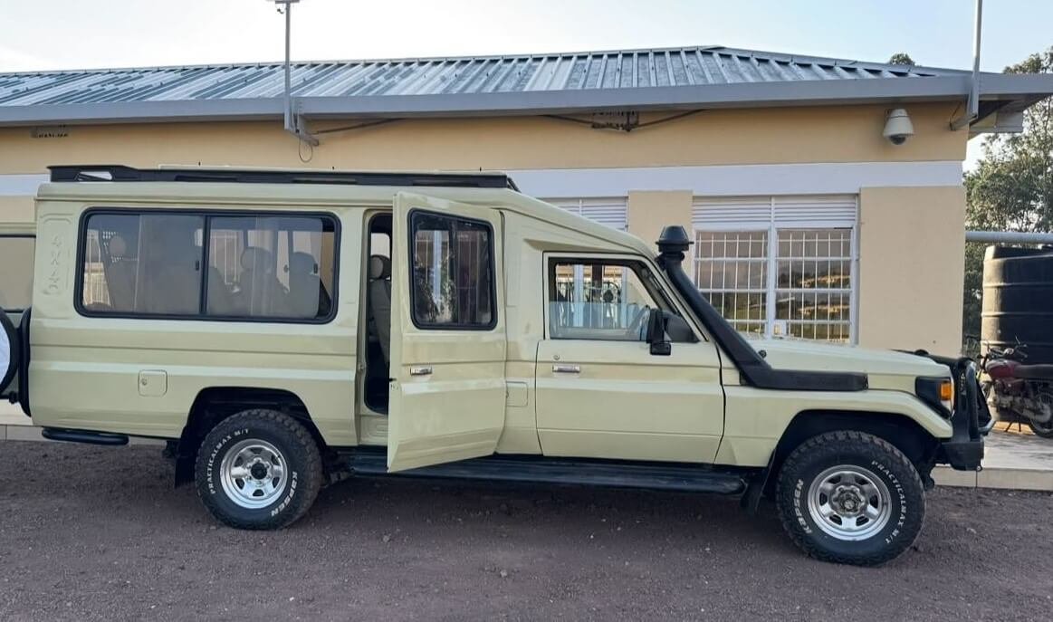 A professional 4x4 safari van parked at a lodge, ideal for showing safari logistics.