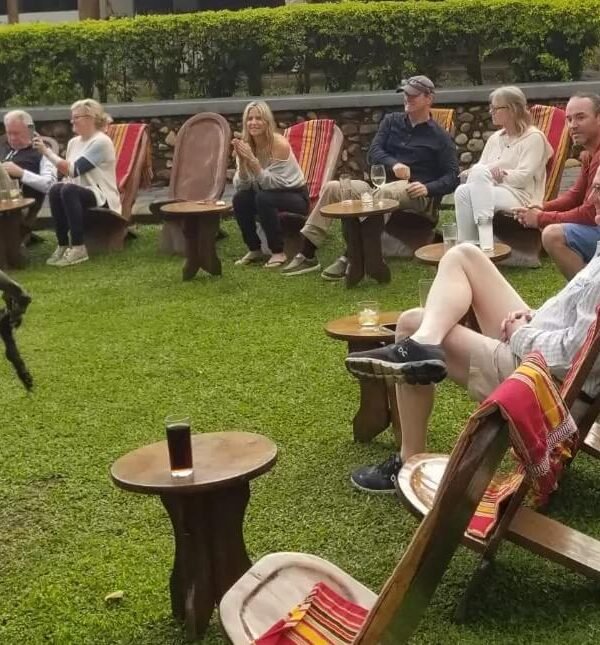 Travellers watching a traditional Ugandan cultural dance performance near Bwindi Forest