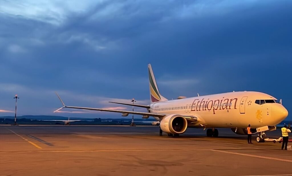 Ethiopian Airlines plane parked at Entebbe International Airport in Uganda at dusk